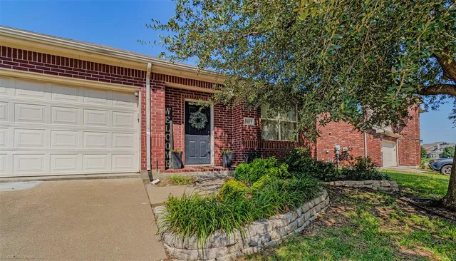 front view of a house with a small yard