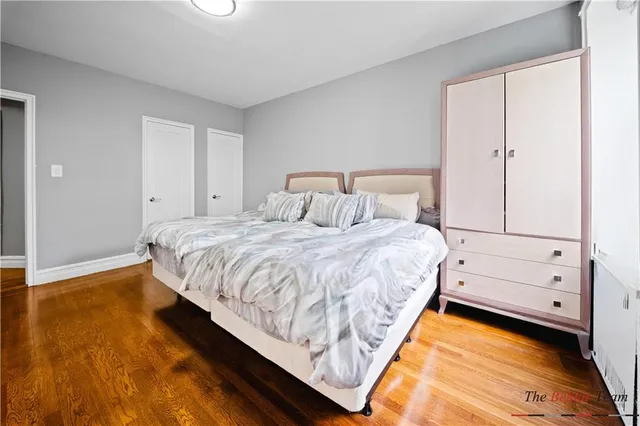 a bed room with a bed and a night stand