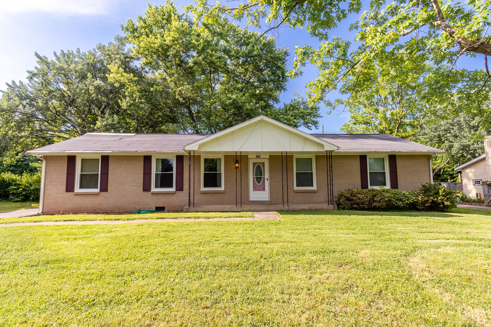 309 Notgrass Road Clarksville, TN 37042 - Photo 1 of 12 a front view of a house with a yard