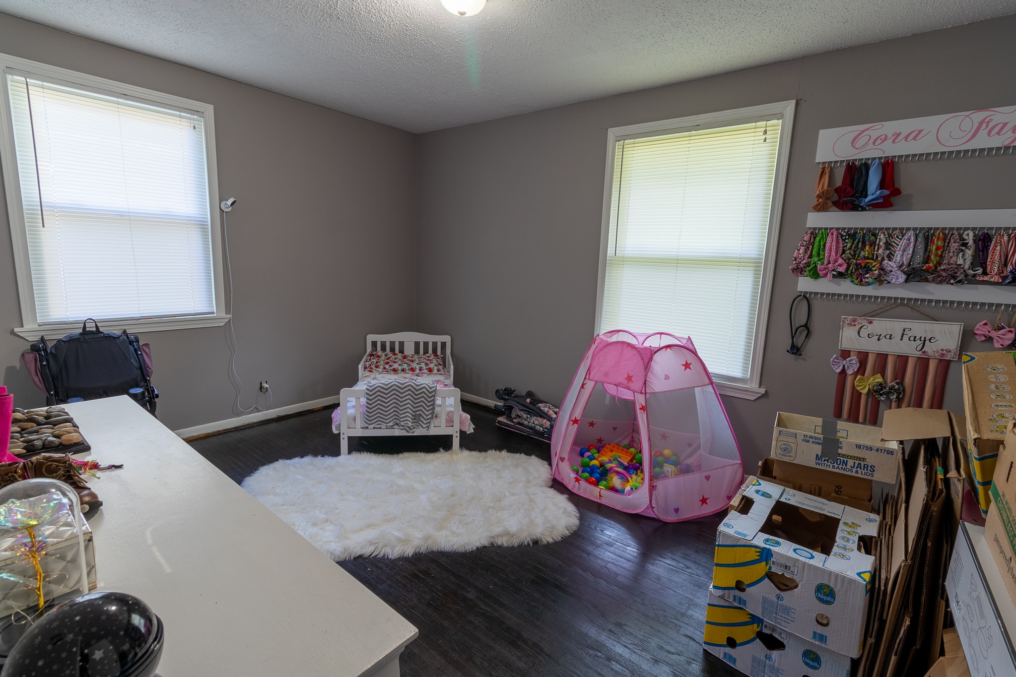 309 Notgrass Road Clarksville, TN 37042 - Photo 8 of 12 a bedroom with furniture and a book shelf