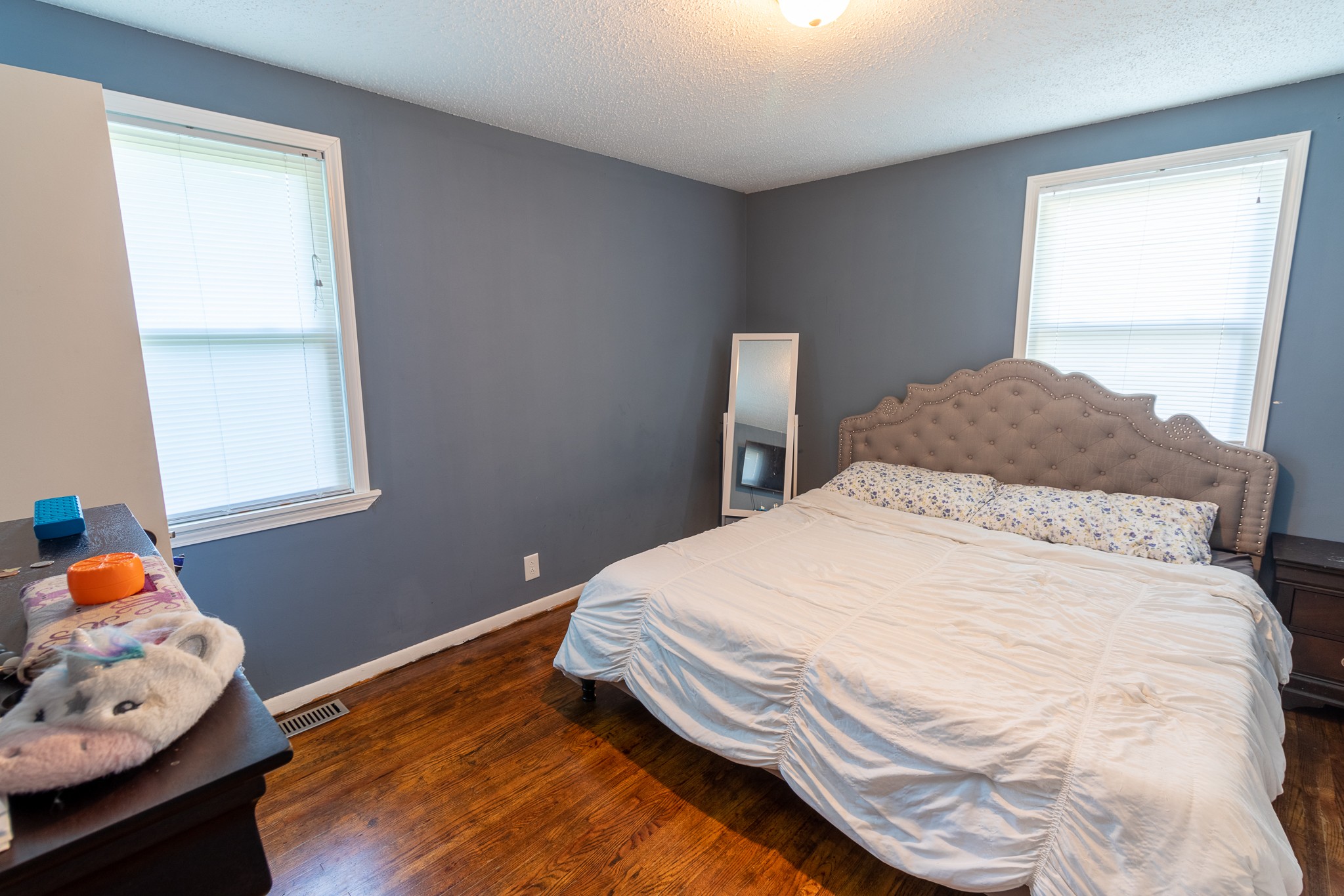 309 Notgrass Road Clarksville, TN 37042 - Photo 9 of 12 a bedroom with a bed and wooden floor