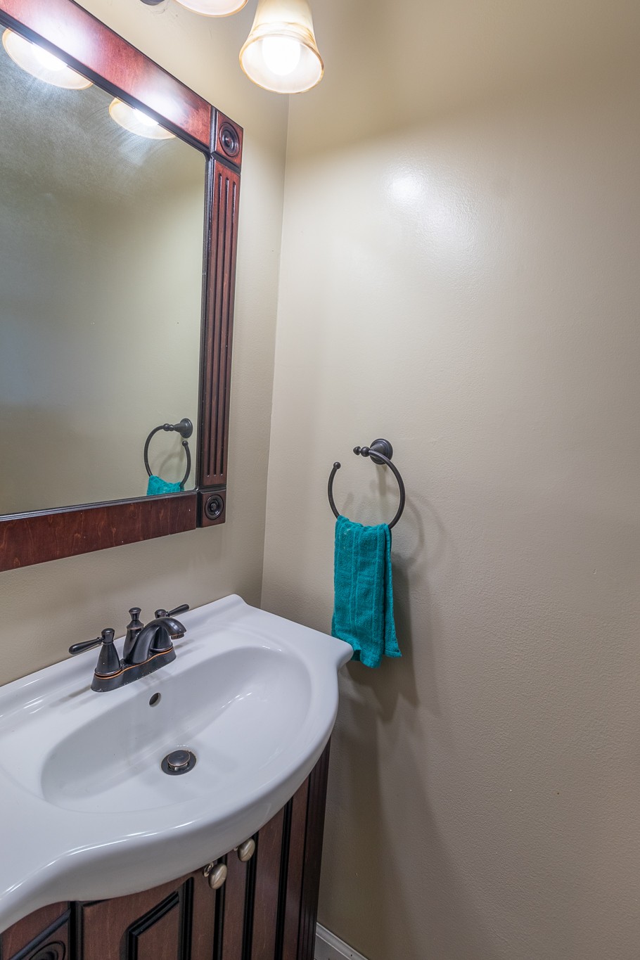 309 Notgrass Road Clarksville, TN 37042 - Photo 10 of 12 a bathroom with a sink and a mirror