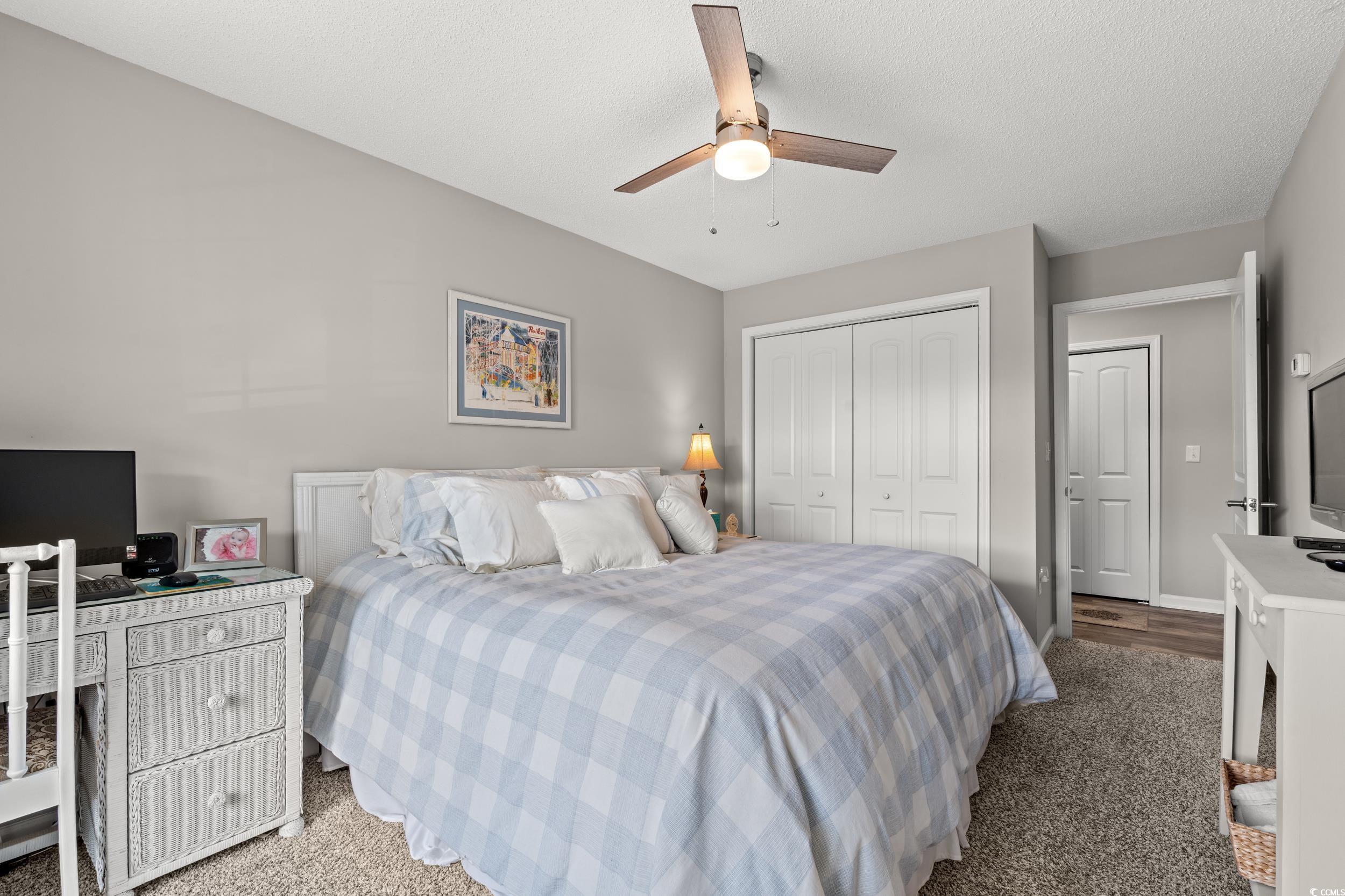 14 Laurel Street, Unit 14 Conway, SC 29526 - Photo 21 of 40 Carpeted bedroom featuring a closet, a ceiling fan, and a textured ceiling