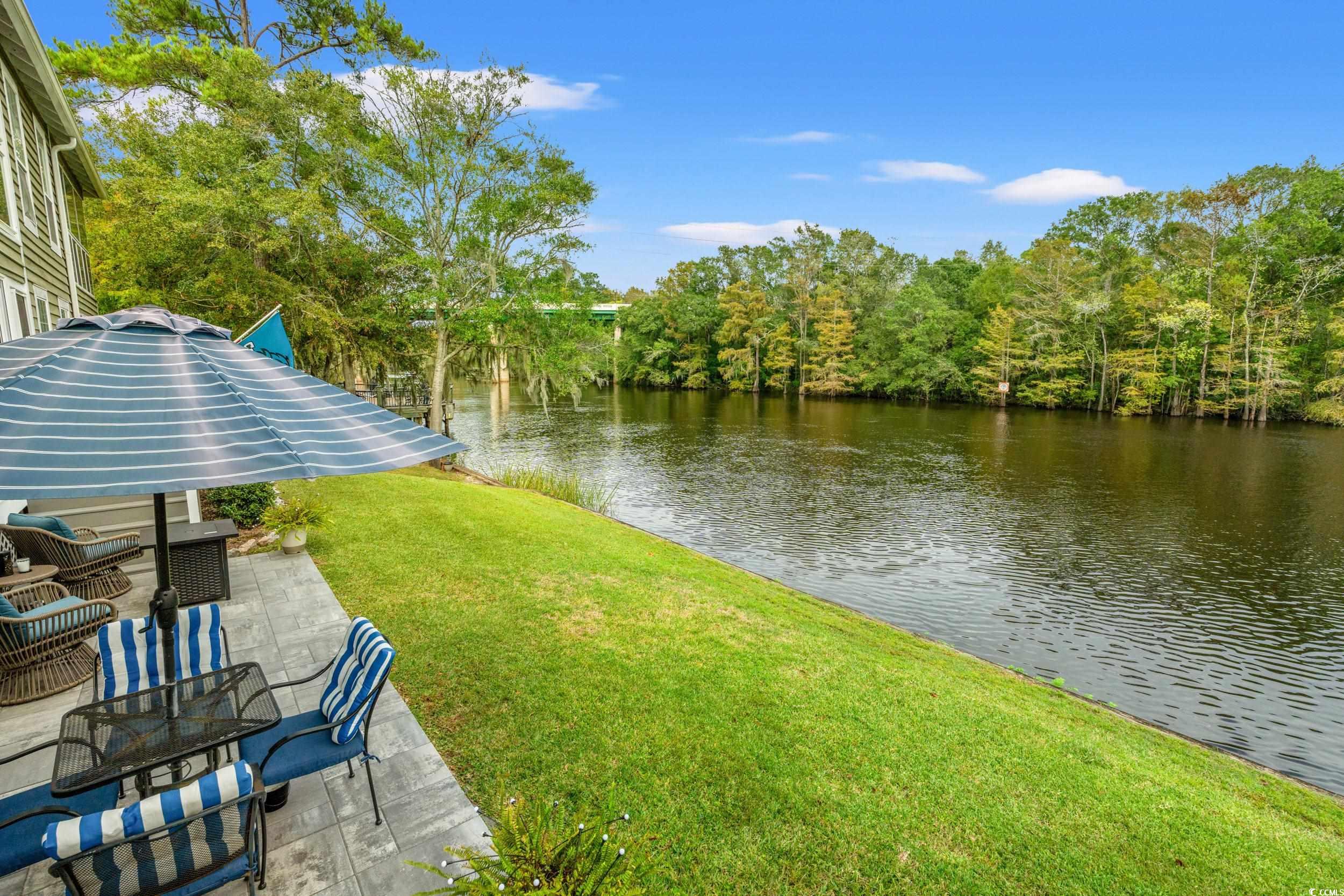 14 Laurel Street, Unit 14 Conway, SC 29526 - Photo 26 of 40 View of grassy yard with a water view and a patio area