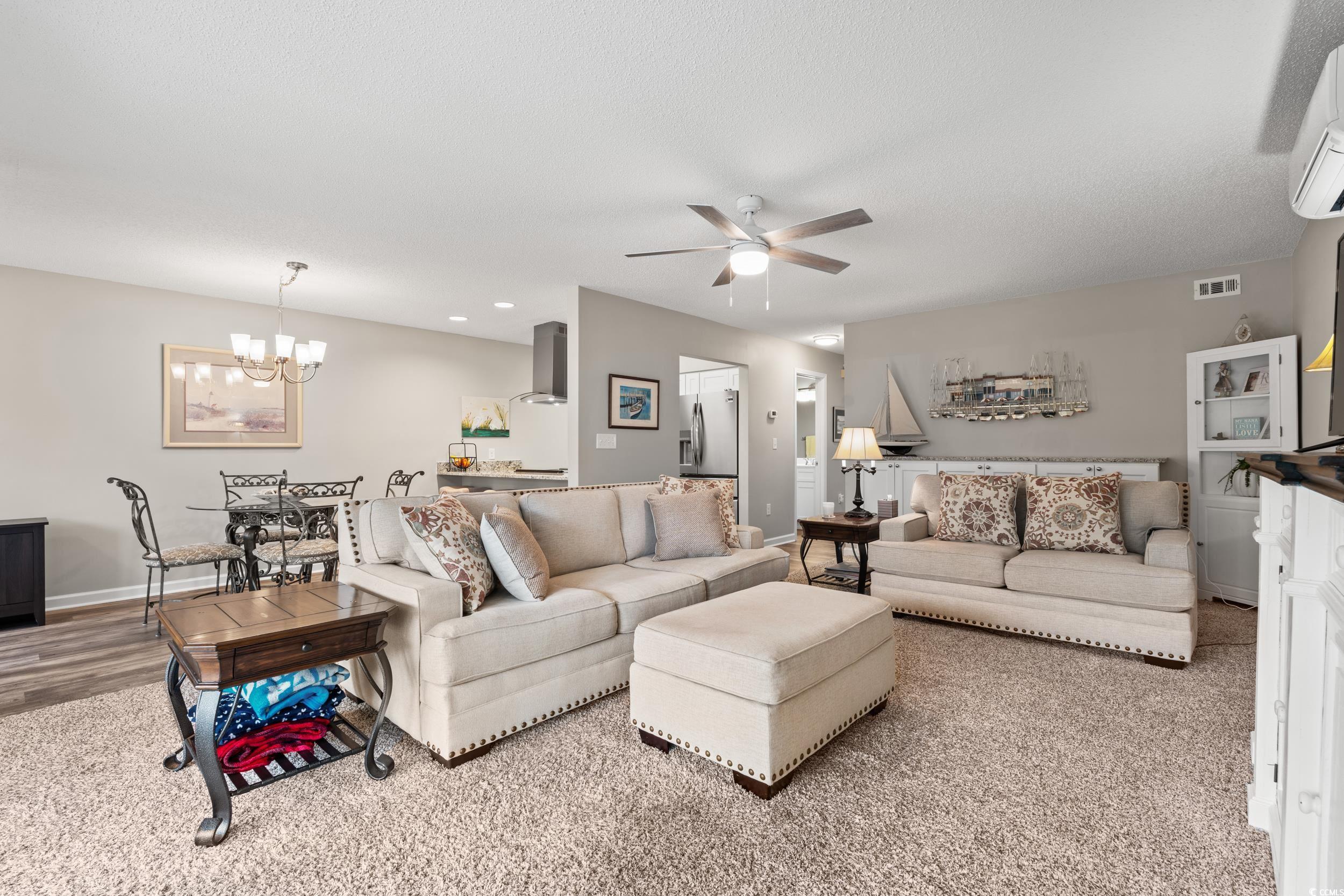 14 Laurel Street, Unit 14 Conway, SC 29526 - Photo 4 of 40 Living area featuring a wall mounted air conditioner, a ceiling fan, a chandelier, and recessed lighting