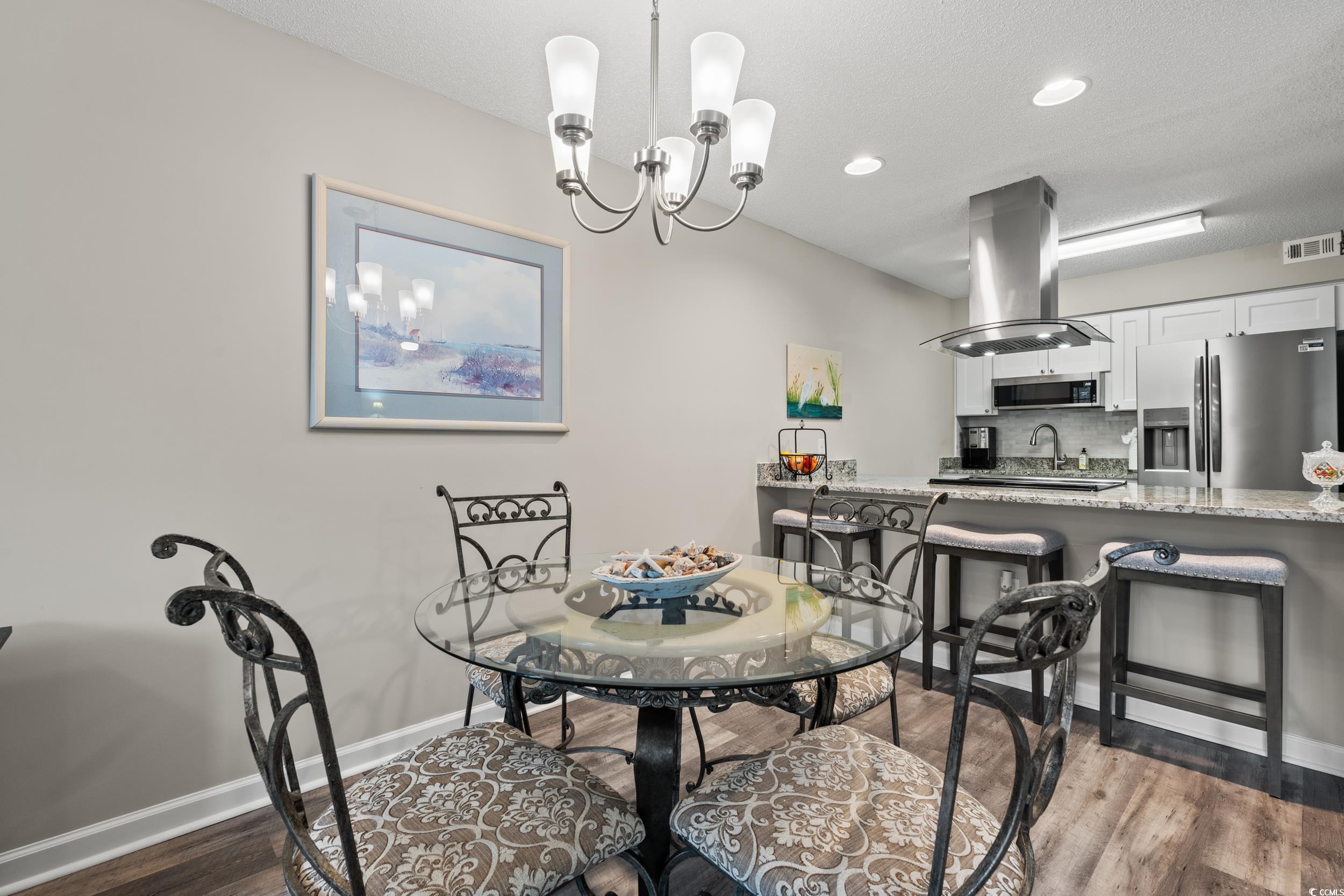14 Laurel Street, Unit 14 Conway, SC 29526 - Photo 10 of 40 Dining room featuring a chandelier, recessed lighting, and dark wood-style floors