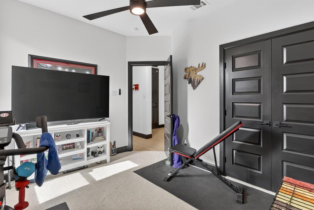 1740 Reverie Road Burleson, TX 76028 - Photo 11 of 37 a living room with furniture and a flat screen tv
