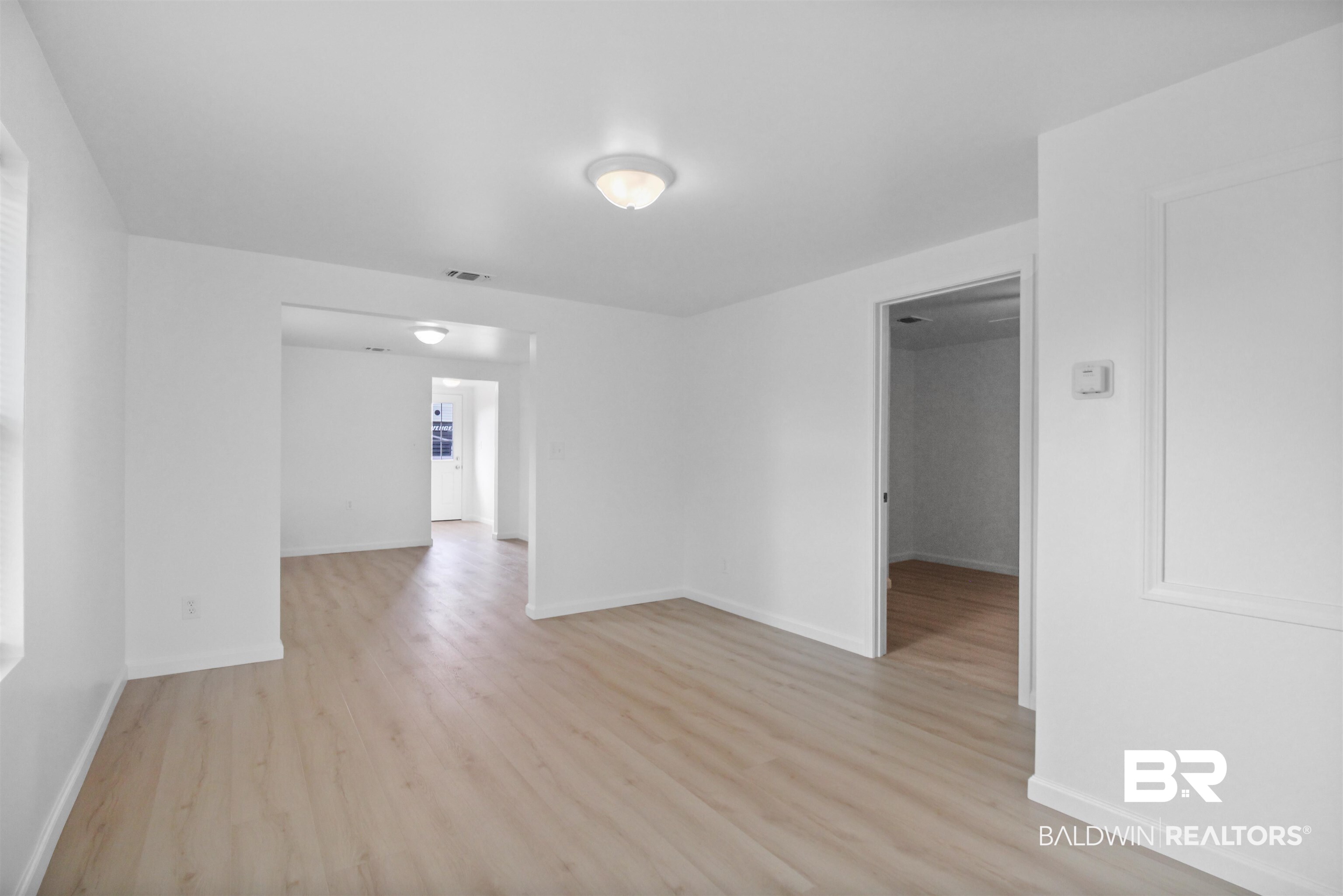 17622 Brewer Road Foley, AL 36535 - Photo 13 of 26 Unfurnished room featuring light wood-type flooring and baseboards