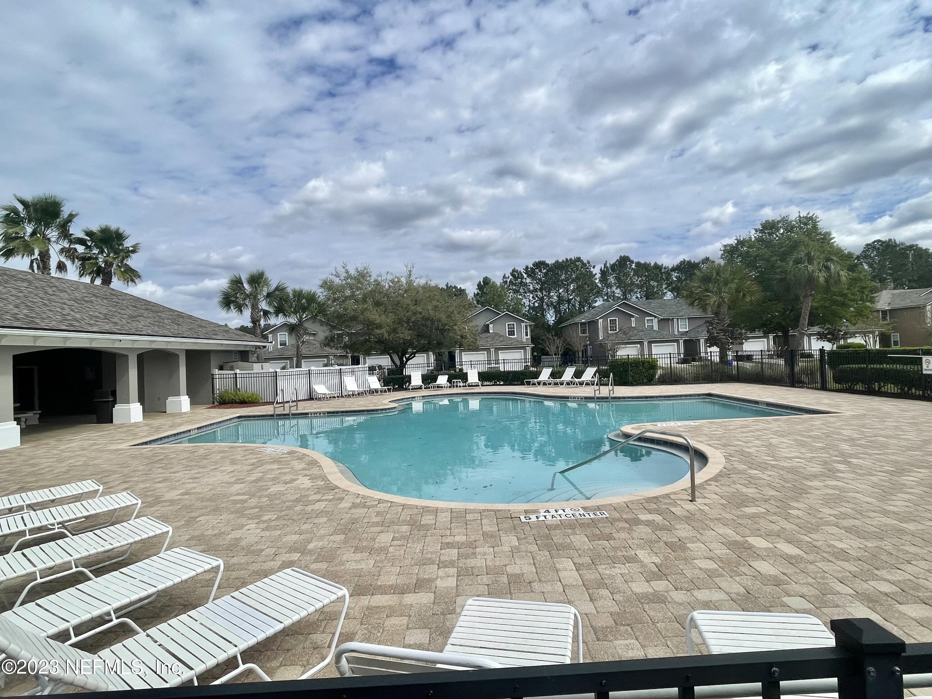 938 Scrub Jay Drive St. Augustine, FL 32092 - Photo 12 of 13 a view of a swimming pool with a patio