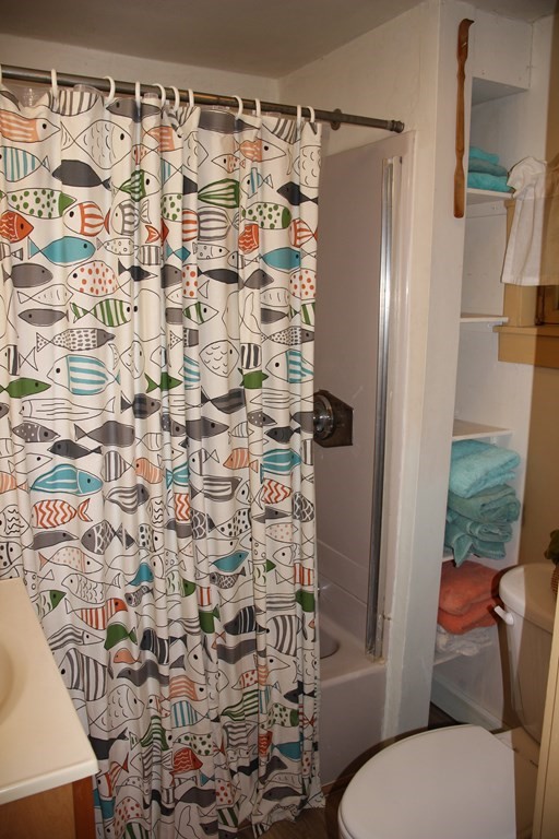 3 York Road Colrain, MA 01340 - Photo 19 of 37 a bathroom with a toilet and shower curtain