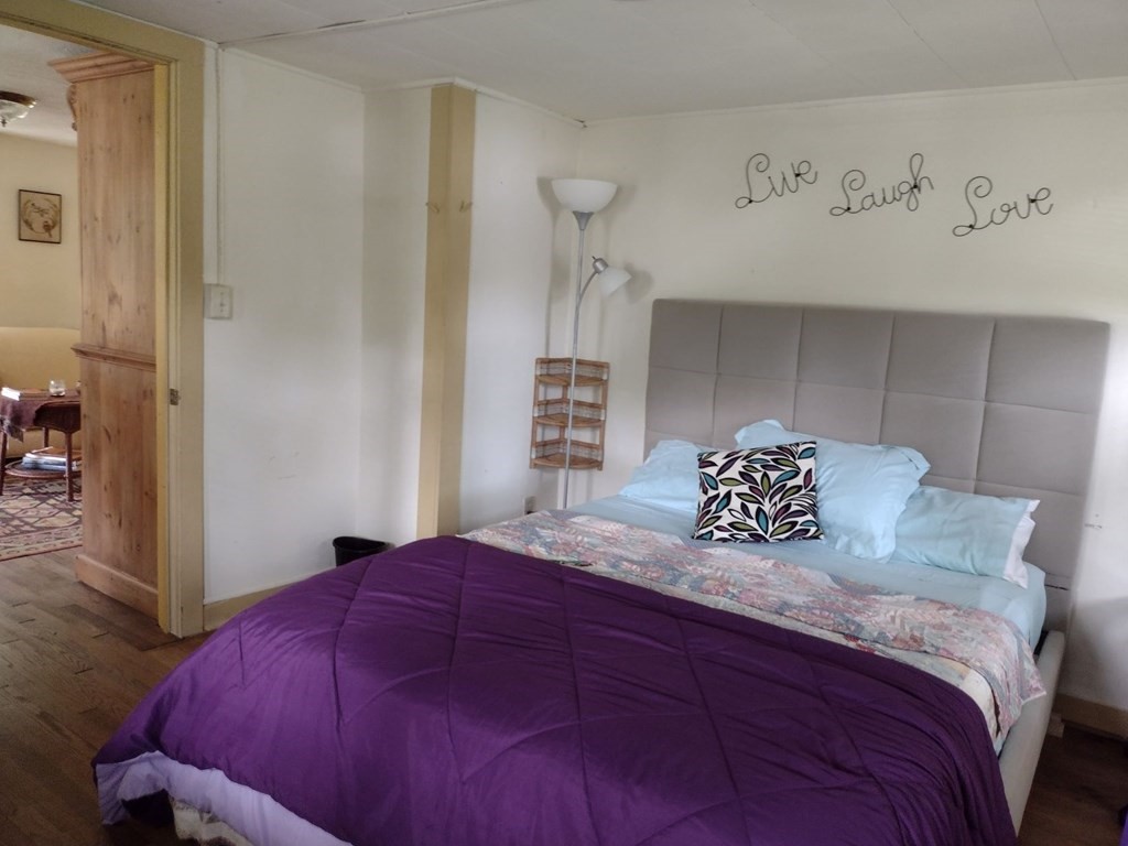 3 York Road Colrain, MA 01340 - Photo 22 of 37 a bedroom with a bed and a table in it
