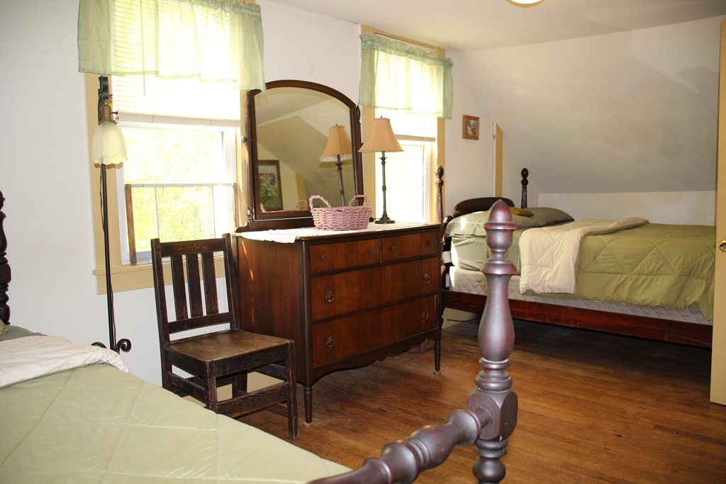 3 York Road Colrain, MA 01340 - Photo 25 of 37 a bedroom with a bed and a dresser next to a window