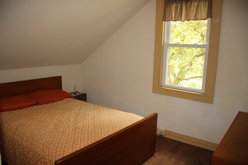3 York Road Colrain, MA 01340 - Photo 26 of 37 a bed sitting in a bedroom next to a window