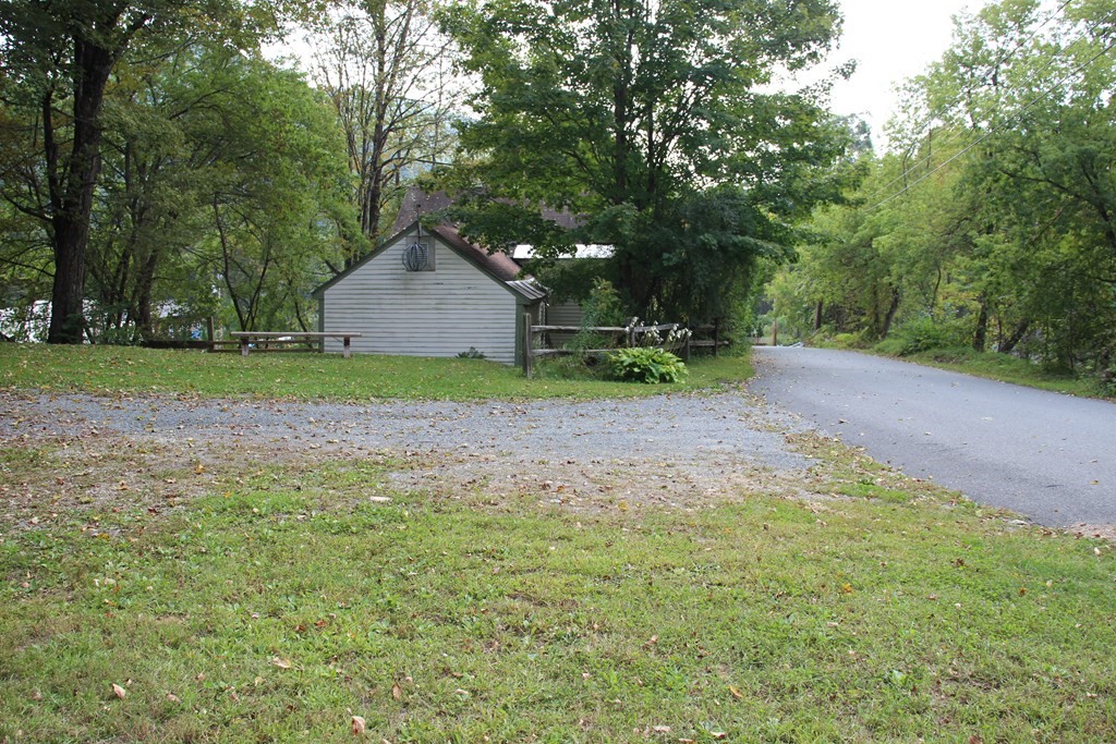 3 York Road Colrain, MA 01340 - Photo 5 of 37 a backyard of a house with trees and outdoor seating