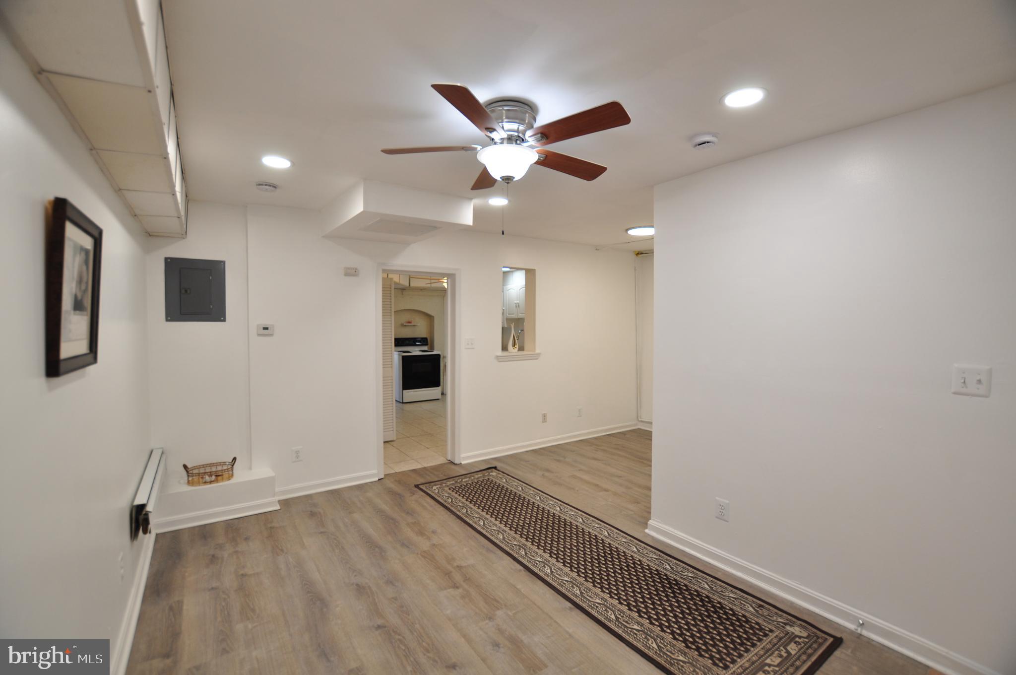 1904 Calvert Street Northwest Washington, DC 20009 - Photo 3 of 13 a view of an empty room with a ceiling fan