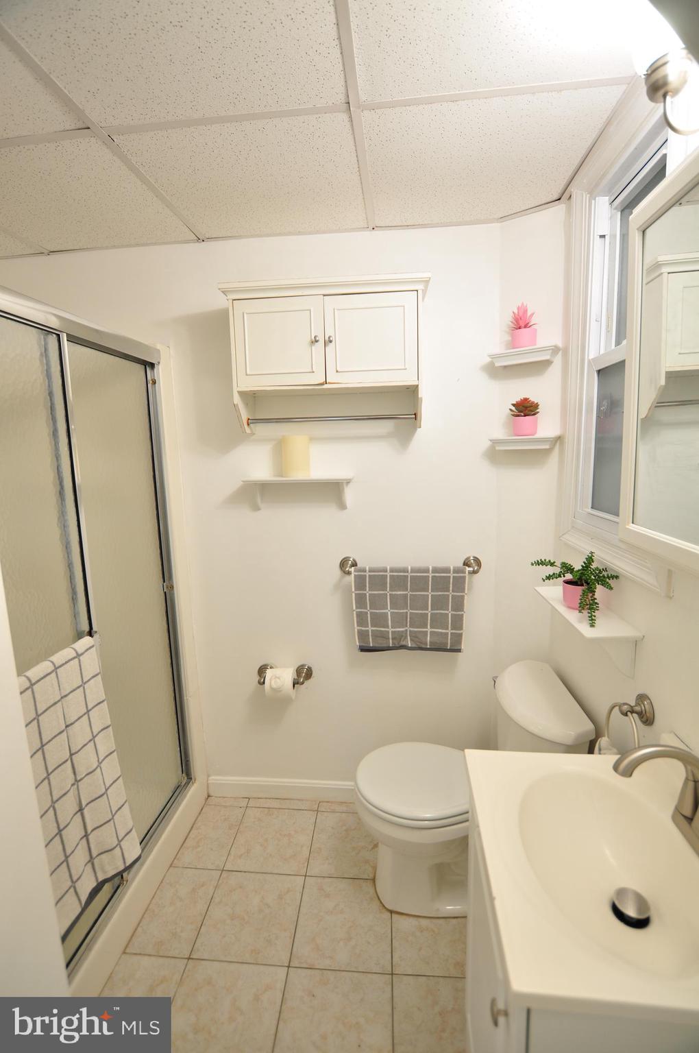 1904 Calvert Street Northwest Washington, DC 20009 - Photo 10 of 13 a bathroom with a sink a toilet and shower