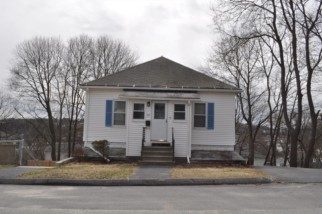 a view of a house with a yard