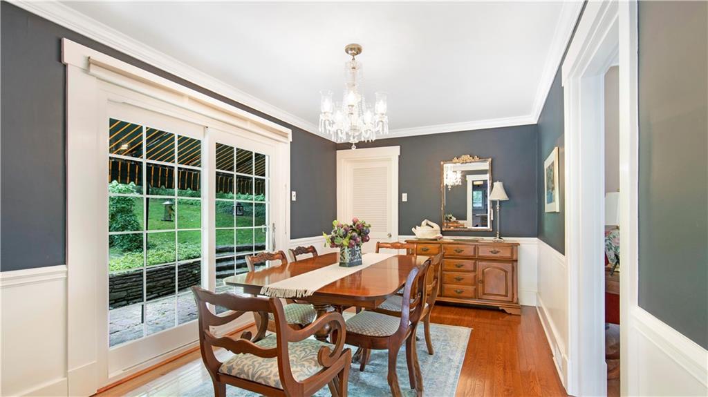 2034 Mohawk Road Pittsburgh, PA 15241 - Photo 5 of 25 a dining room with furniture a chandelier and wooden floor