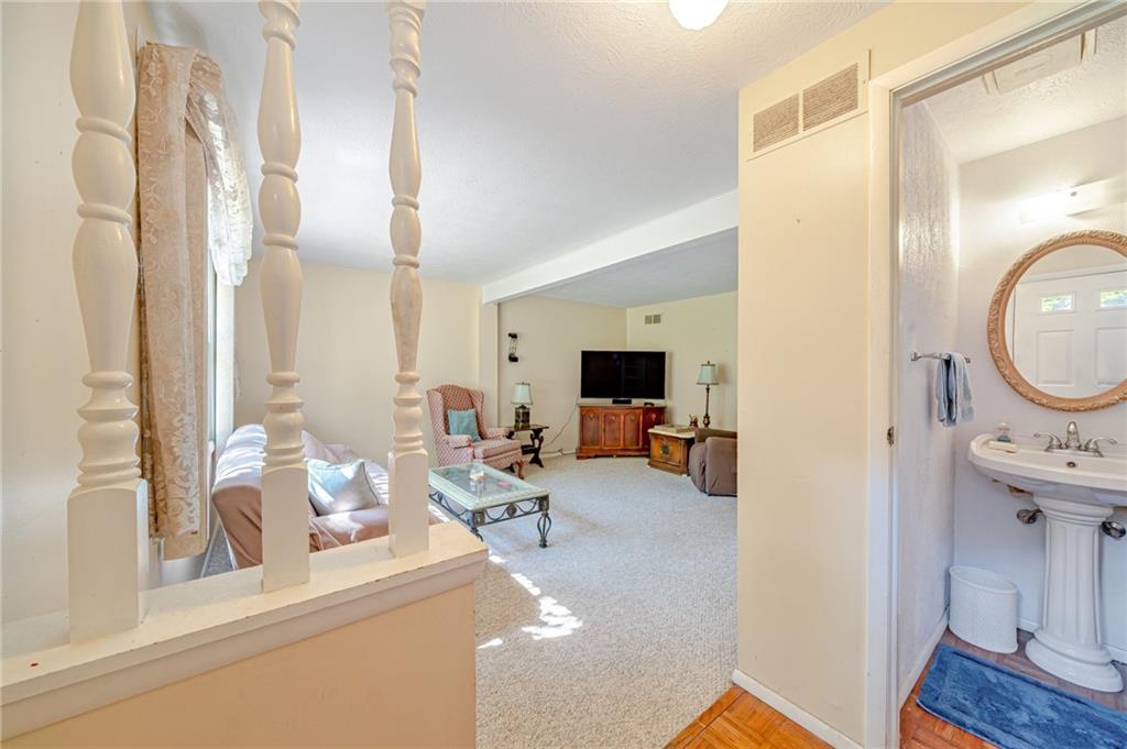 301 Quail Run Road Venetia, PA 15367 - Photo 3 of 27 a living room with furniture and a flat screen tv