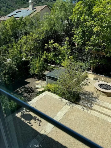 a view of a yard with an outdoor seating