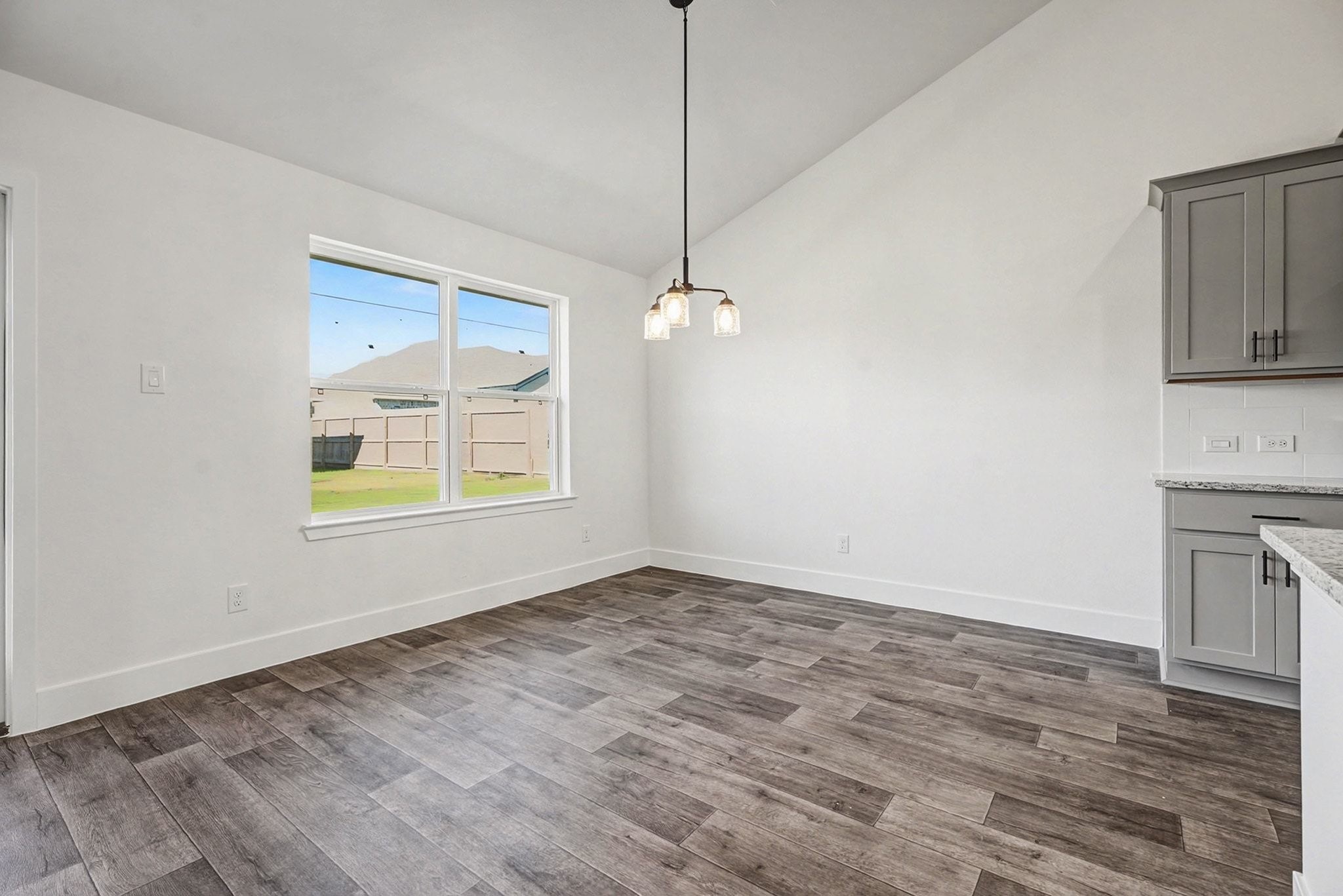 2 Keystone Court Angleton, TX 77515 - Photo 15 of 30 a view of an empty room with window and wooden floor