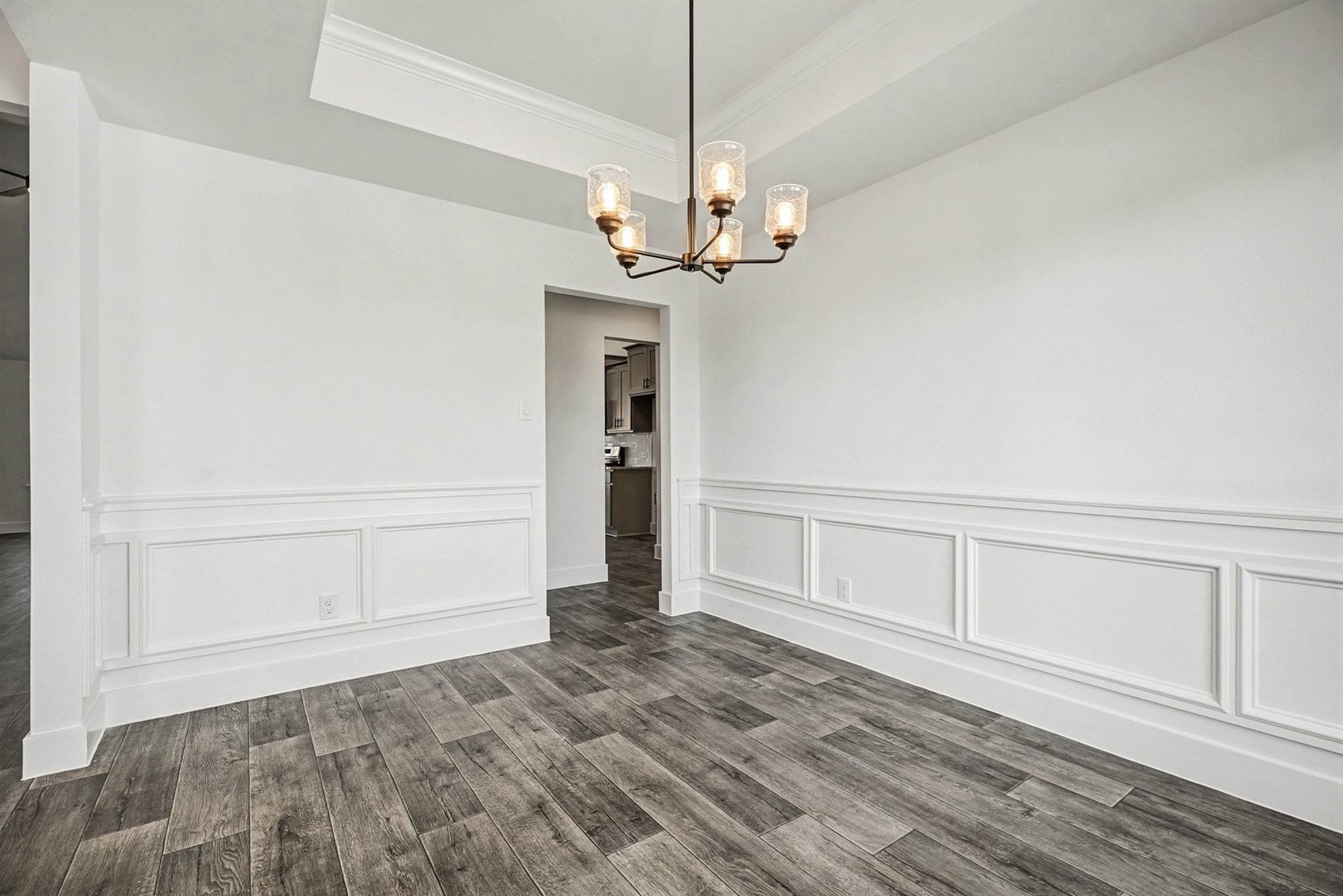 2 Keystone Court Angleton, TX 77515 - Photo 17 of 30 a view of a room with wooden floor and chandelier