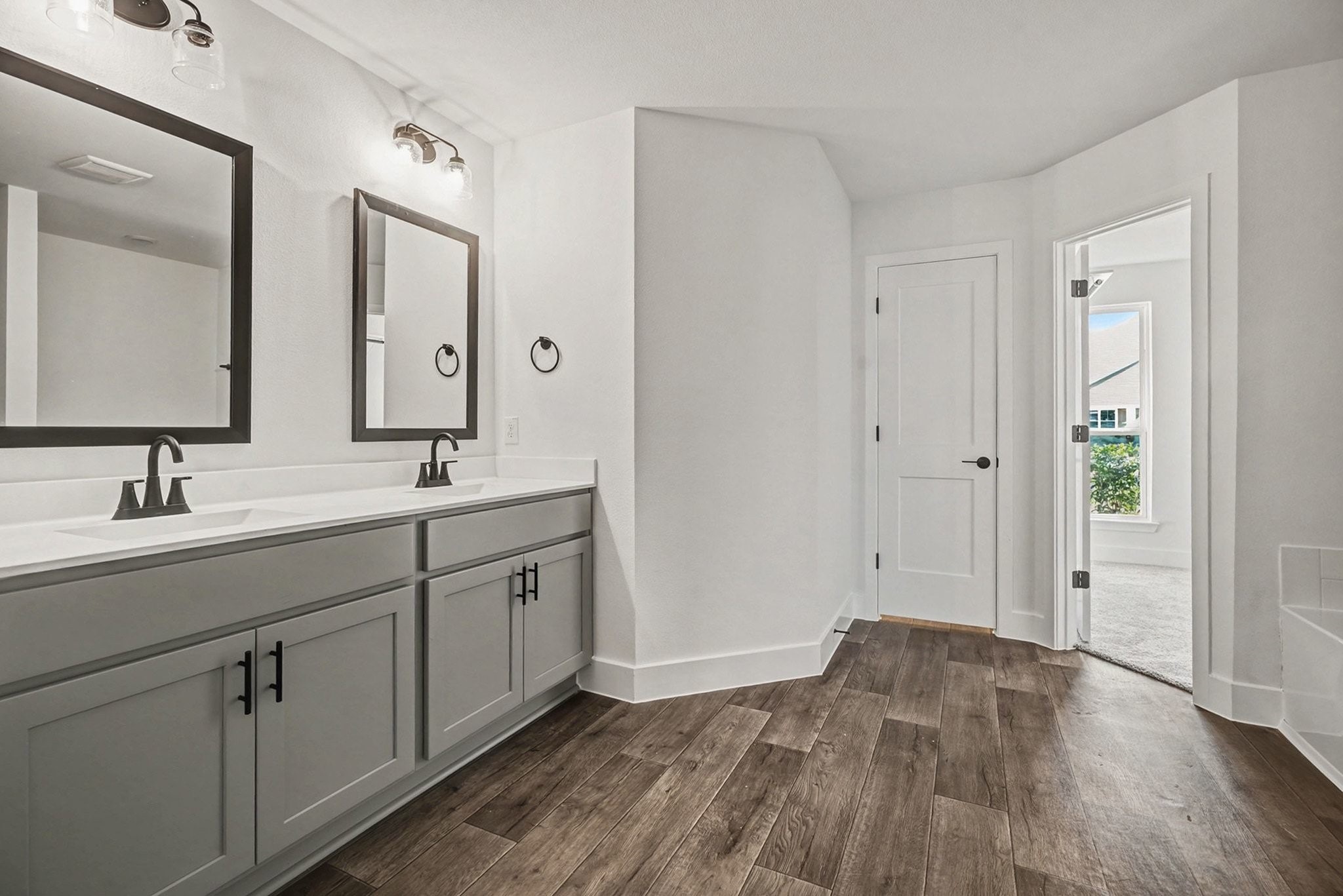2 Keystone Court Angleton, TX 77515 - Photo 21 of 30 a spacious bathroom with a double vanity sink and mirror