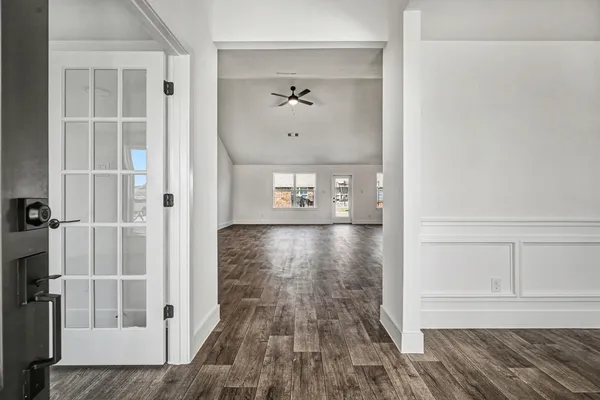wooden floor in a hall with a window