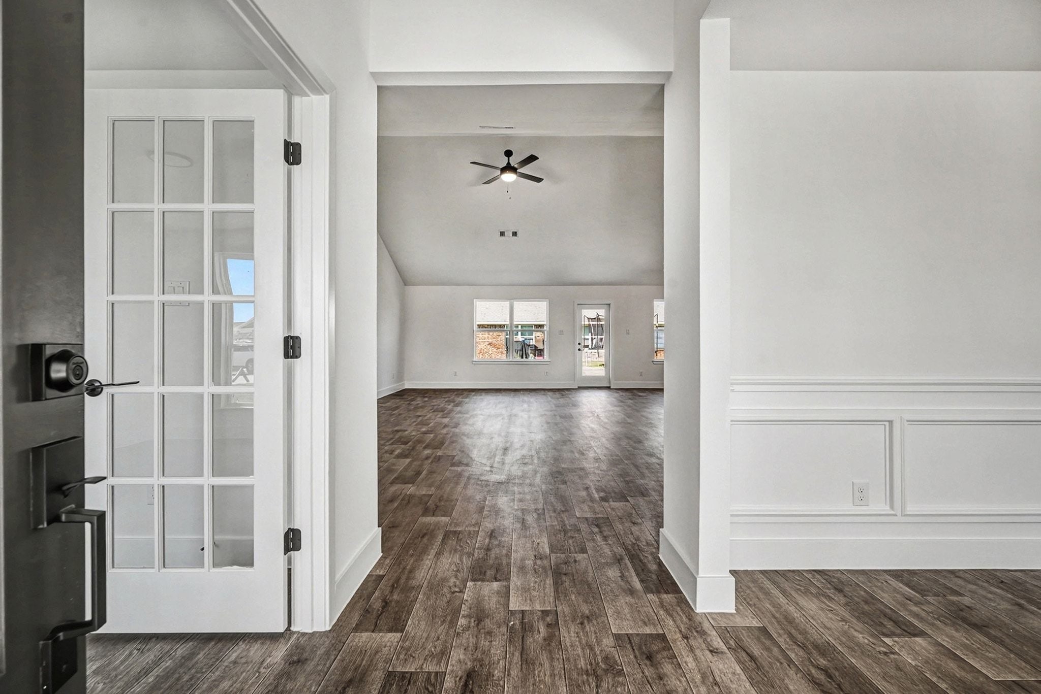 2 Keystone Court Angleton, TX 77515 - Photo 5 of 30 wooden floor in a hall with a window