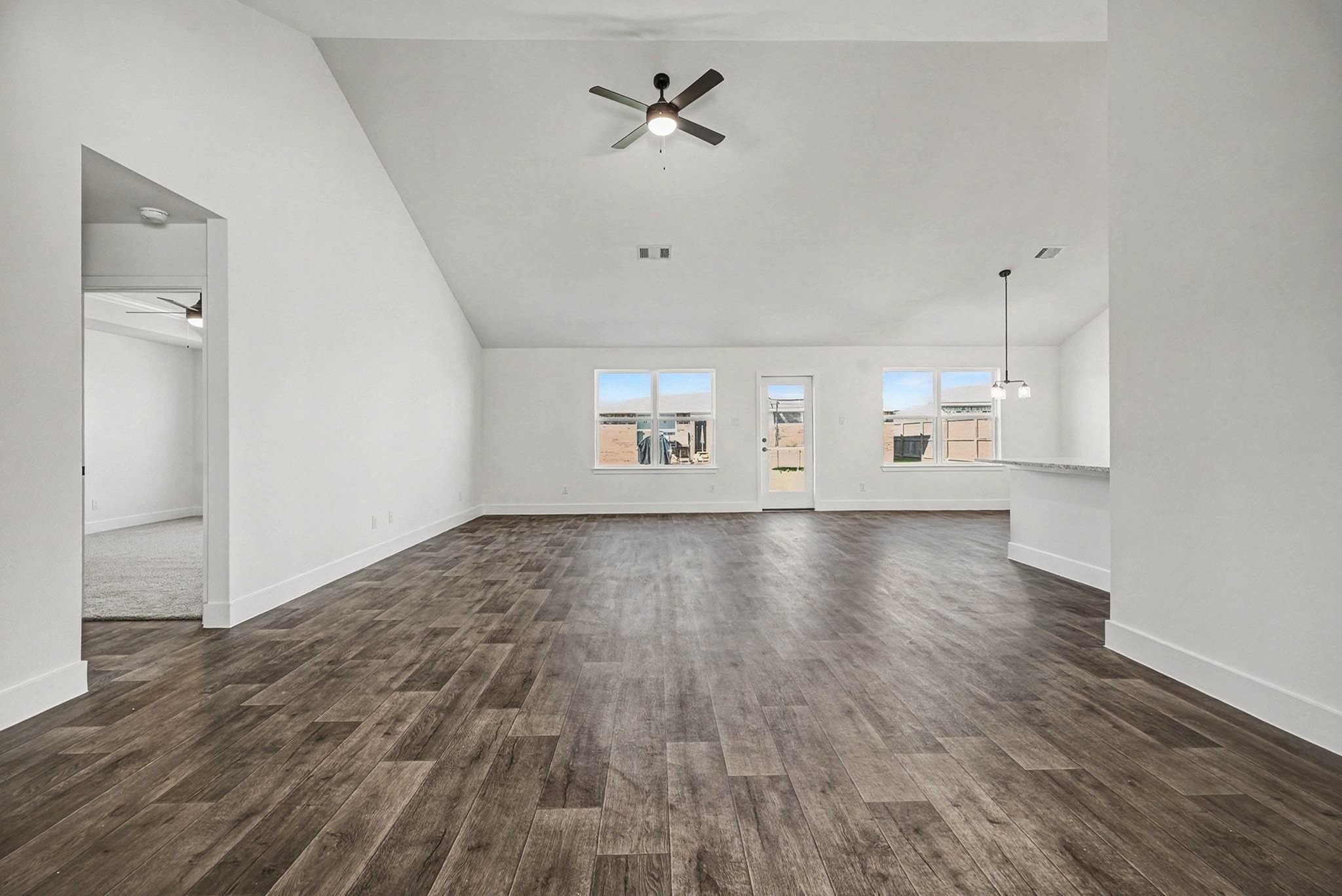 2 Keystone Court Angleton, TX 77515 - Photo 7 of 30 an empty room with wooden floor and windows