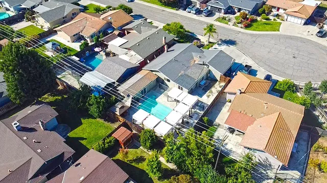 a aerial view of residential houses with outdoor space