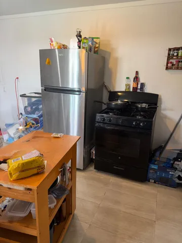 a utility room with cabinets and washer