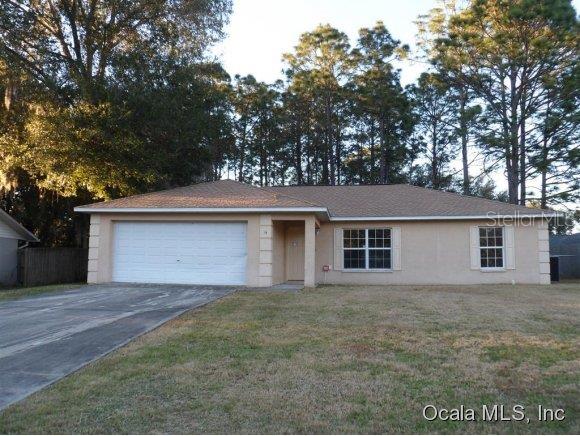 14 Cedar Tree Terrace Ocala, FL 34472 - Photo 1 of 1 front view of house with a yard