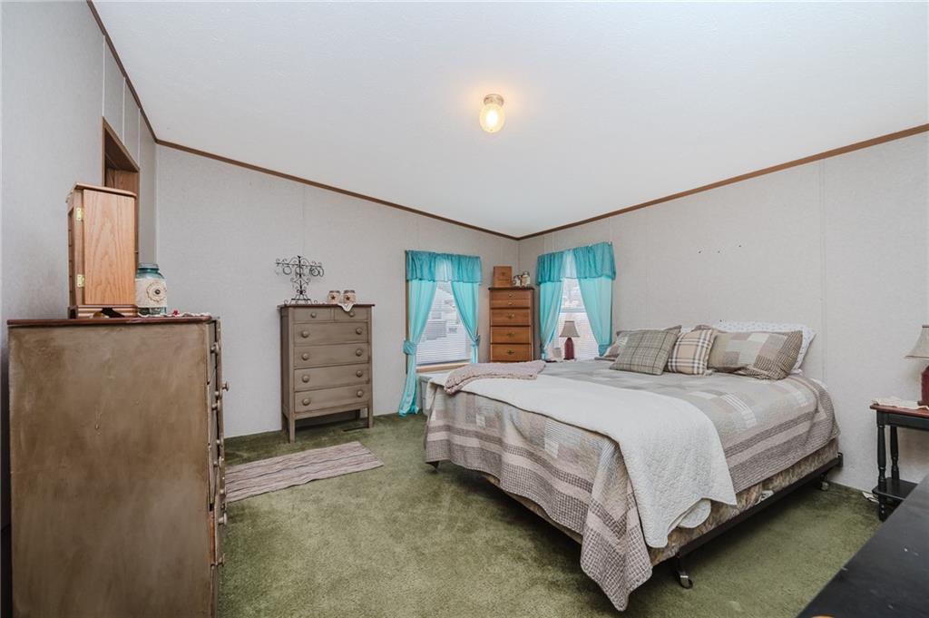 464 Rte 119 Highway North Indiana, PA 15701 - Photo 20 of 37 a bedroom with a bed and a refrigerator