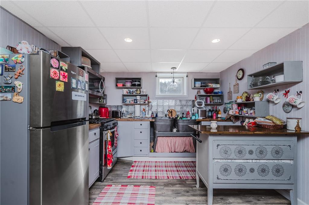 464 Rte 119 Highway North Indiana, PA 15701 - Photo 32 of 37 a kitchen with refrigerator and cabinets