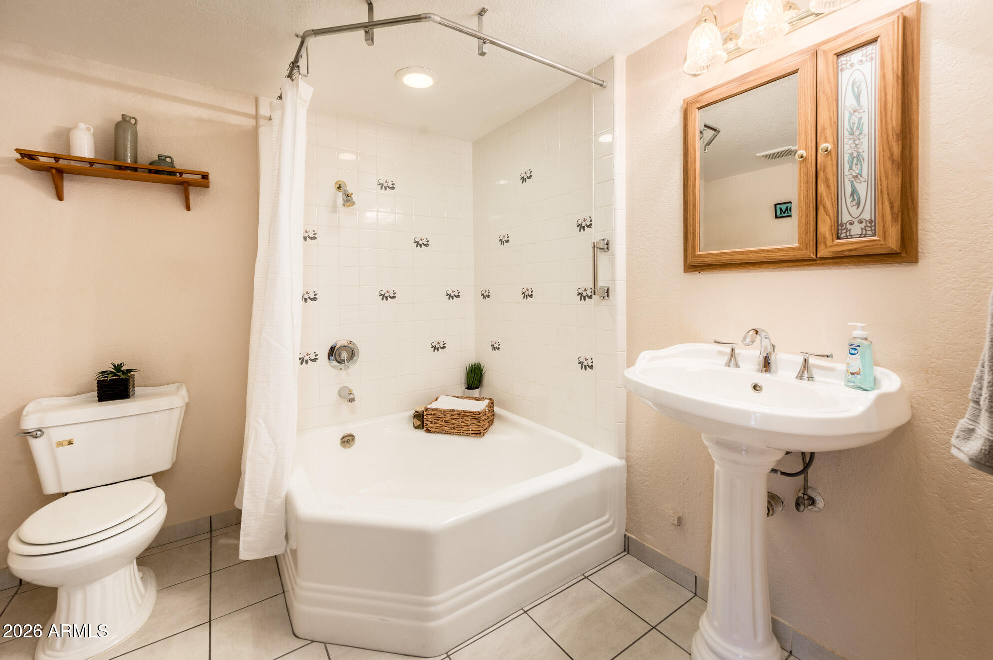 7027 West Wagoner Road Glendale, AZ 85308 - Photo 19 of 29 a bathroom with a sink toilet and shower