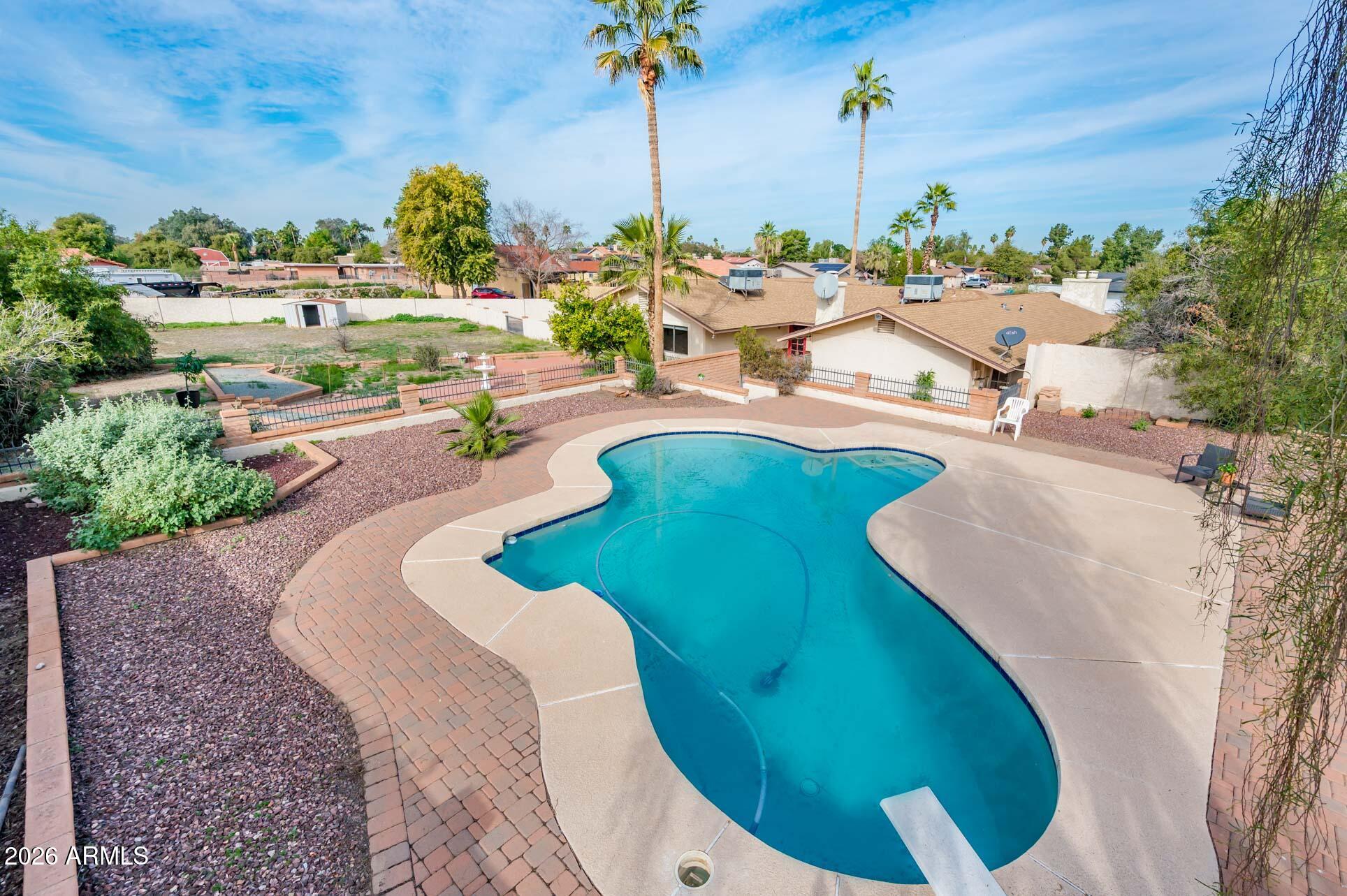 7027 West Wagoner Road Glendale, AZ 85308 - Photo 2 of 29 an aerial view of a swimming pool