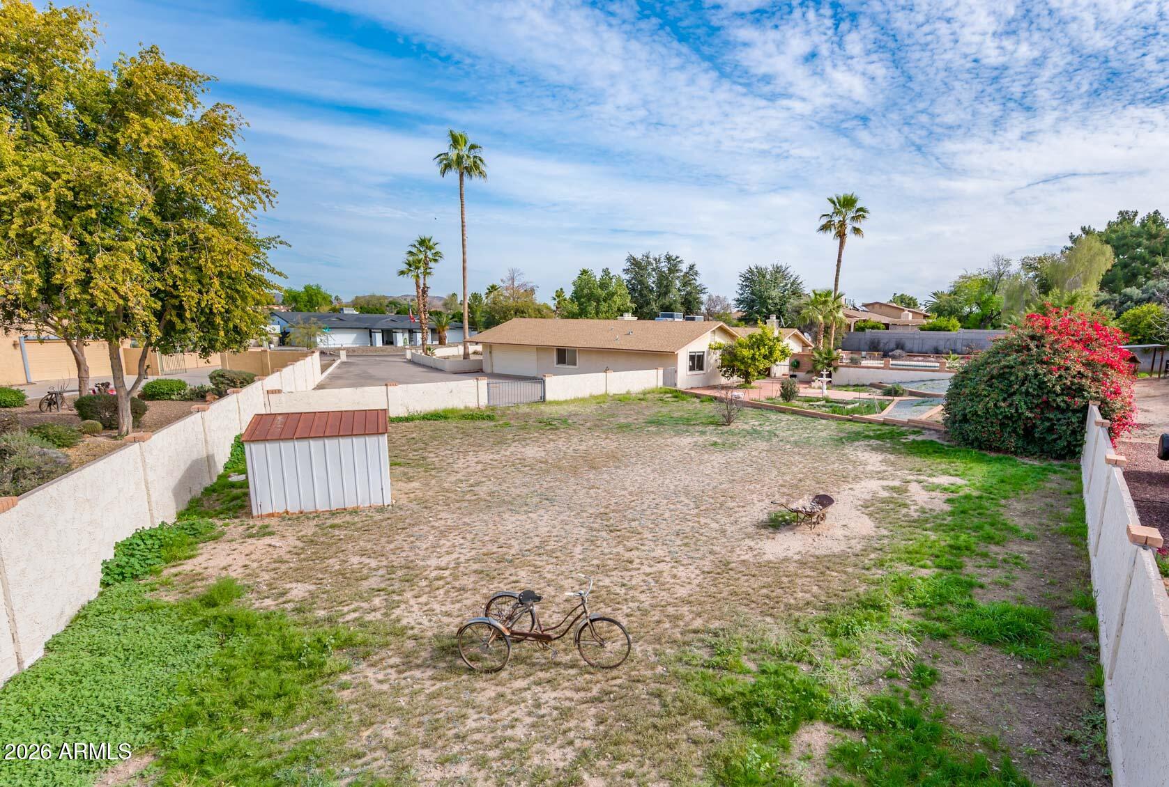 7027 West Wagoner Road Glendale, AZ 85308 - Photo 28 of 29 a view of a backyard with plants and patio