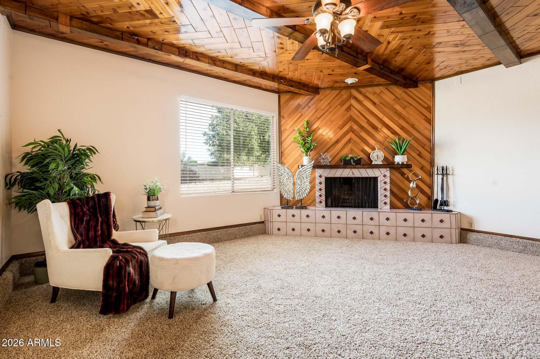 7027 West Wagoner Road Glendale, AZ 85308 - Photo 5 of 29 a living room with furniture and a flat screen tv