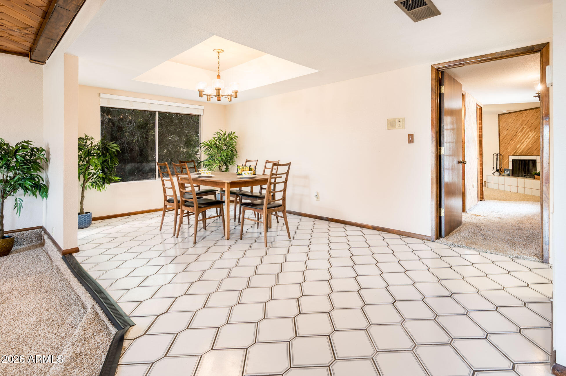 7027 West Wagoner Road Glendale, AZ 85308 - Photo 8 of 29 a dining room with furniture and window