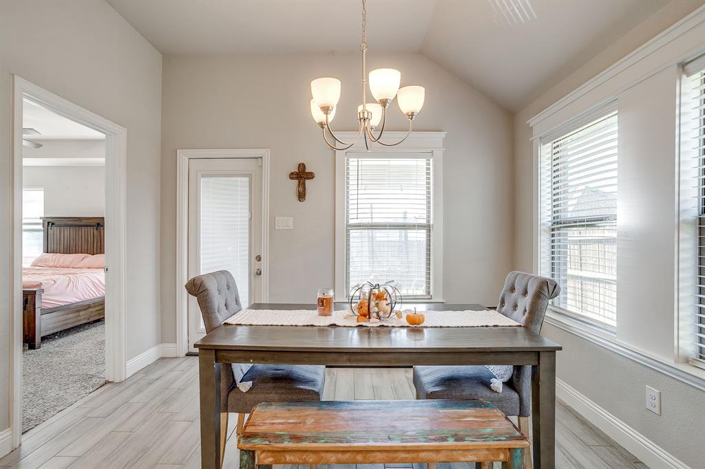 940 Sam Street Springtown, TX 76082 - Photo 17 of 39 a view of a dining room with furniture window and wooden floor