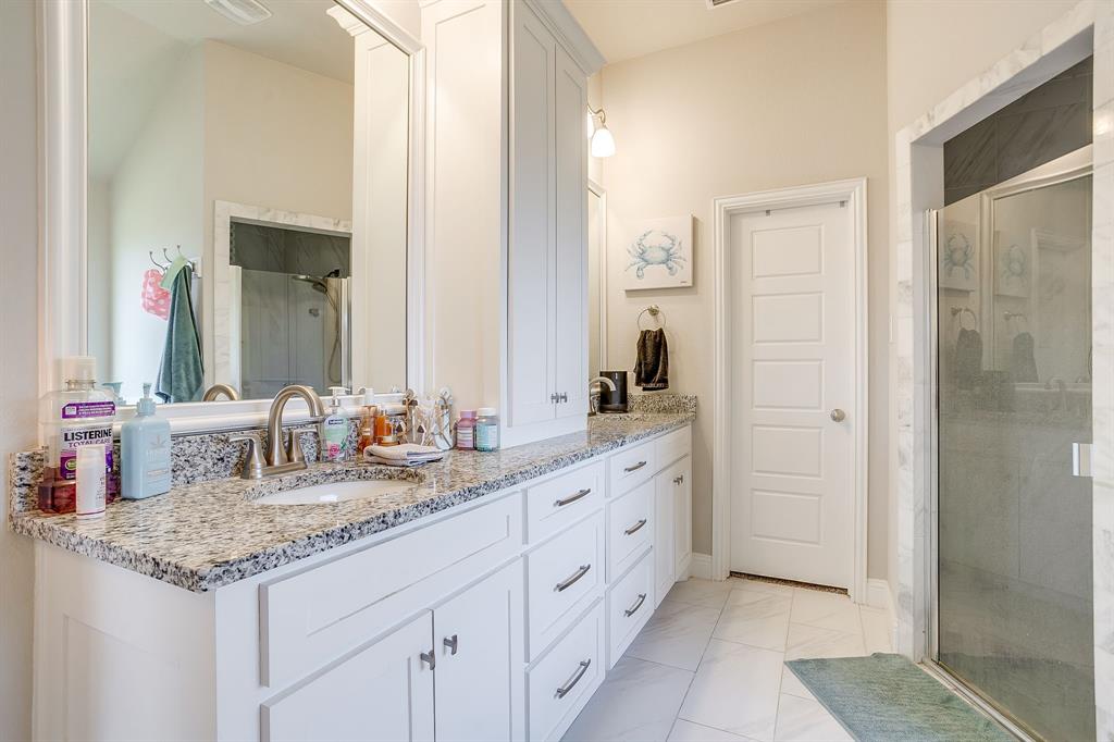 940 Sam Street Springtown, TX 76082 - Photo 26 of 39 a bathroom with double sink and two mirror