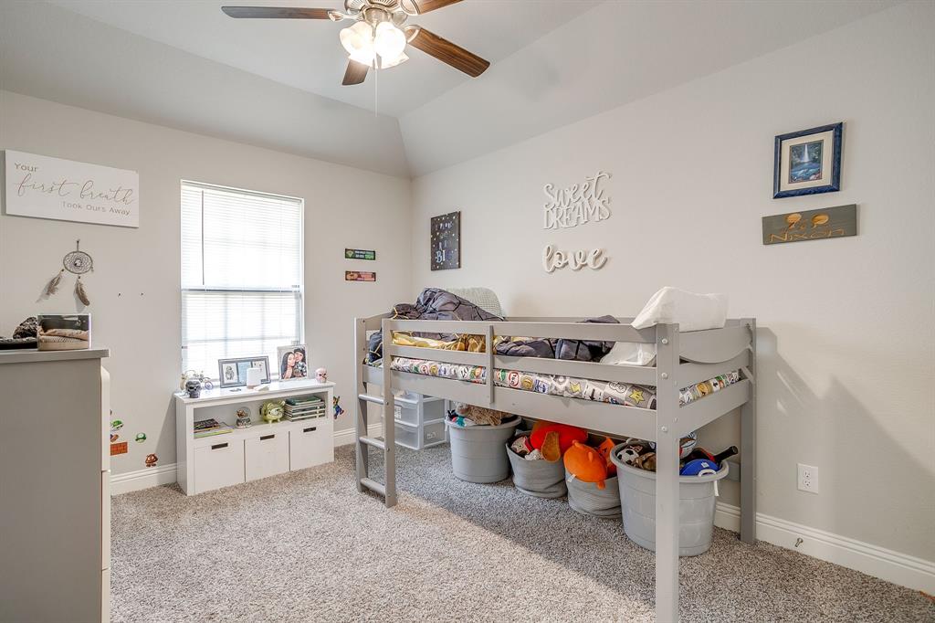 940 Sam Street Springtown, TX 76082 - Photo 31 of 39 a utility room with stainless steel appliances lots of clutter and washer