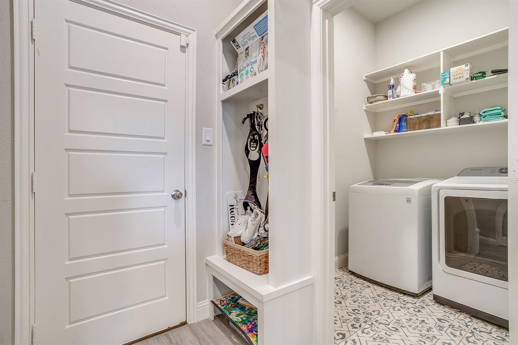 940 Sam Street Springtown, TX 76082 - Photo 35 of 39 a view of storage and utility room with washer and dryer
