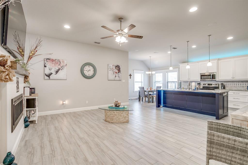 940 Sam Street Springtown, TX 76082 - Photo 6 of 39 a view of kitchen with furniture and wooden floor