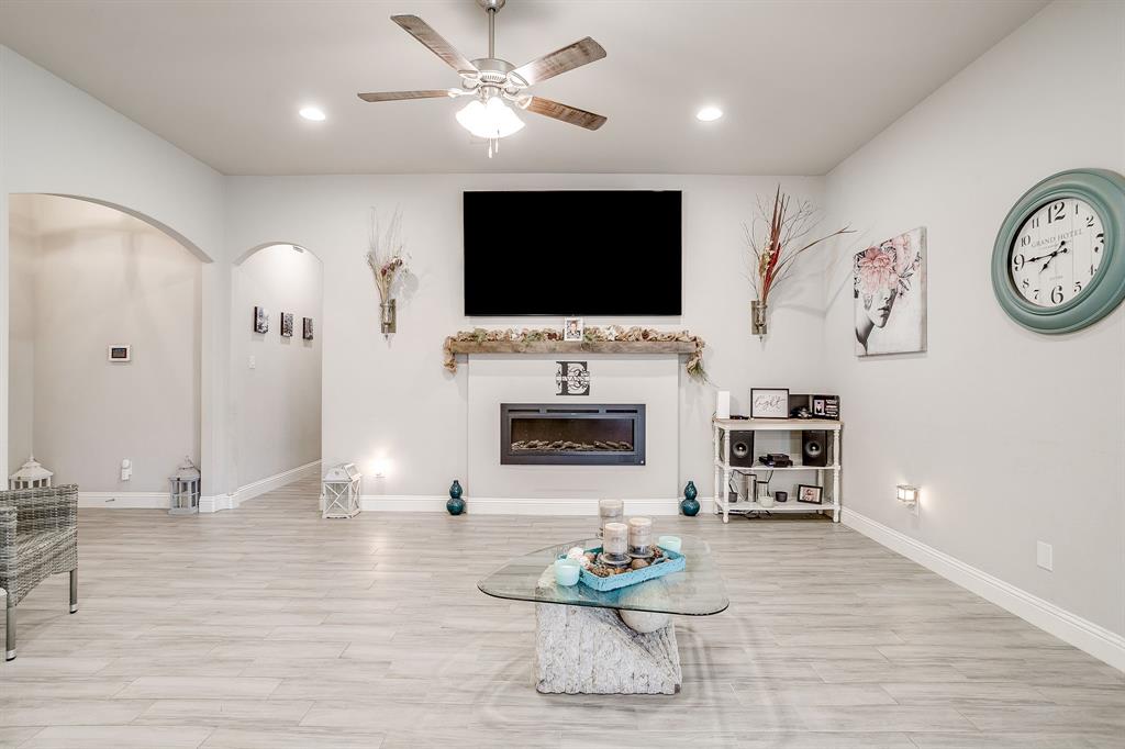940 Sam Street Springtown, TX 76082 - Photo 8 of 39 a living room with furniture and a flat screen tv