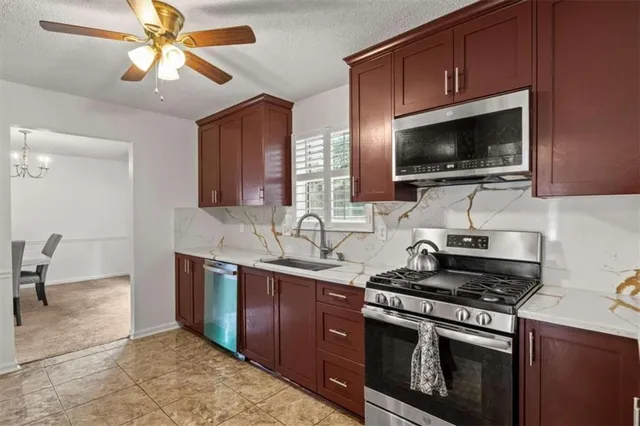 a kitchen with a stove and a microwave
