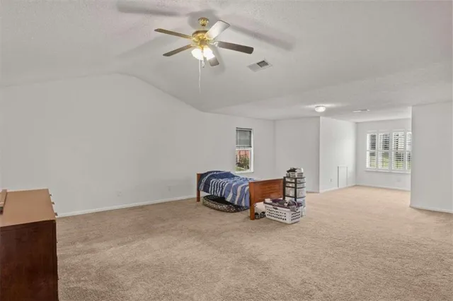 a furnished livingroom with a window