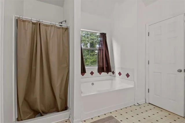a bathroom with a bathtub and a sink