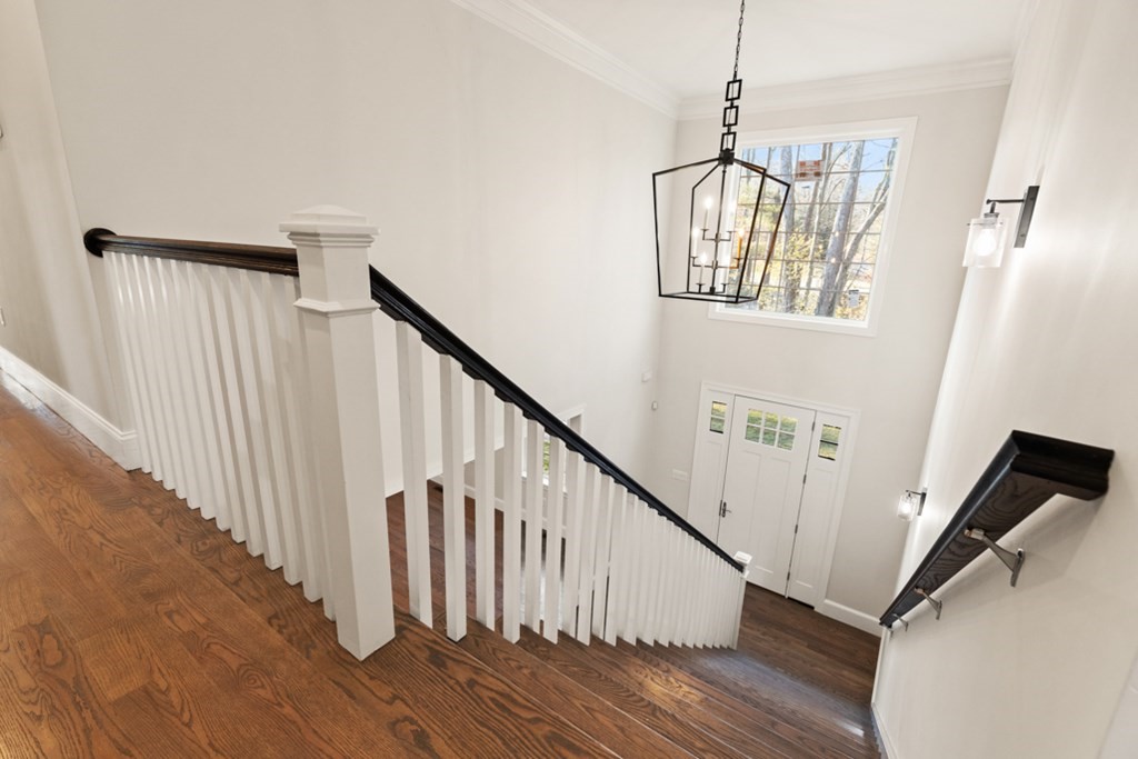 21 Vera Road Middleton, MA 01949 - Photo 17 of 41 a view of staircase with wooden floor and white walls